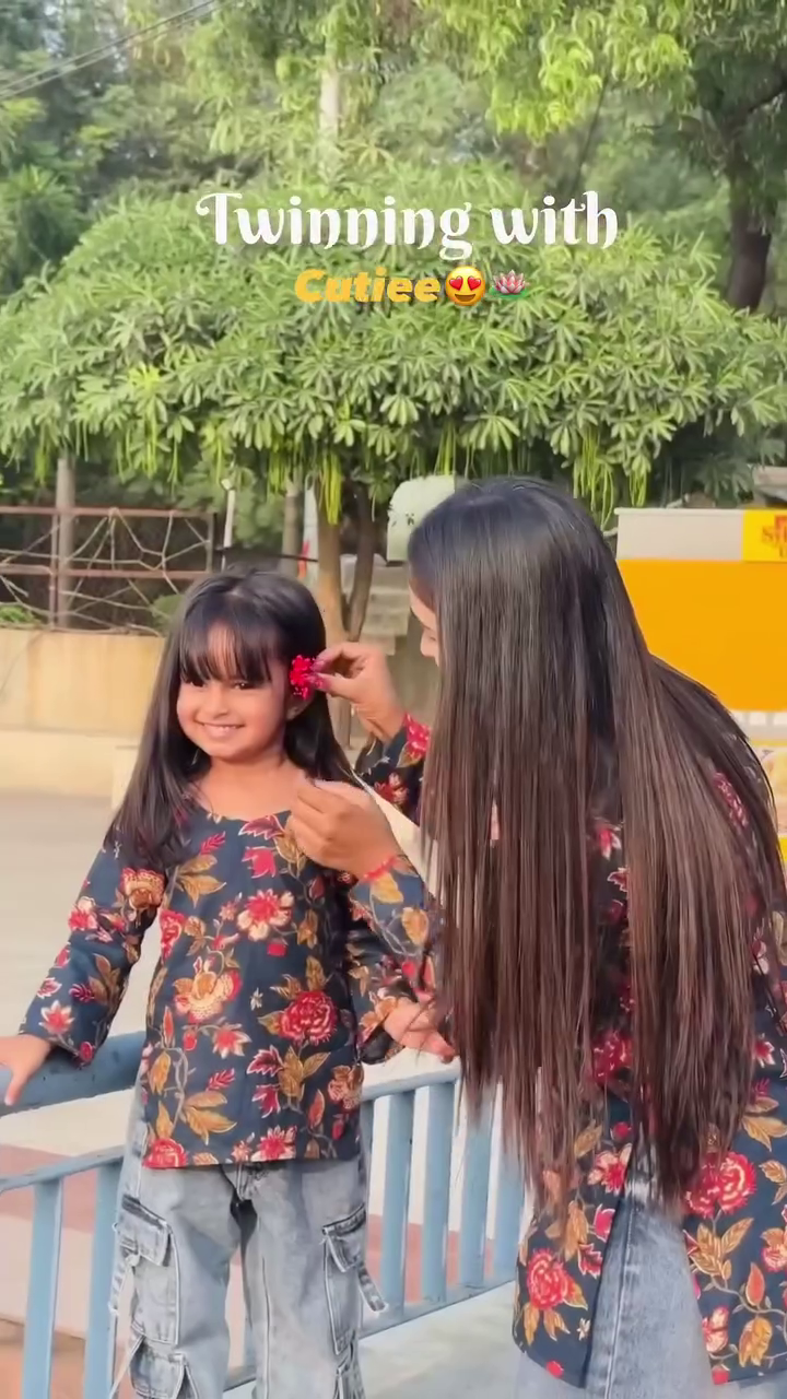 Twinning Floral Outfit Moment Between Mother and Daughter