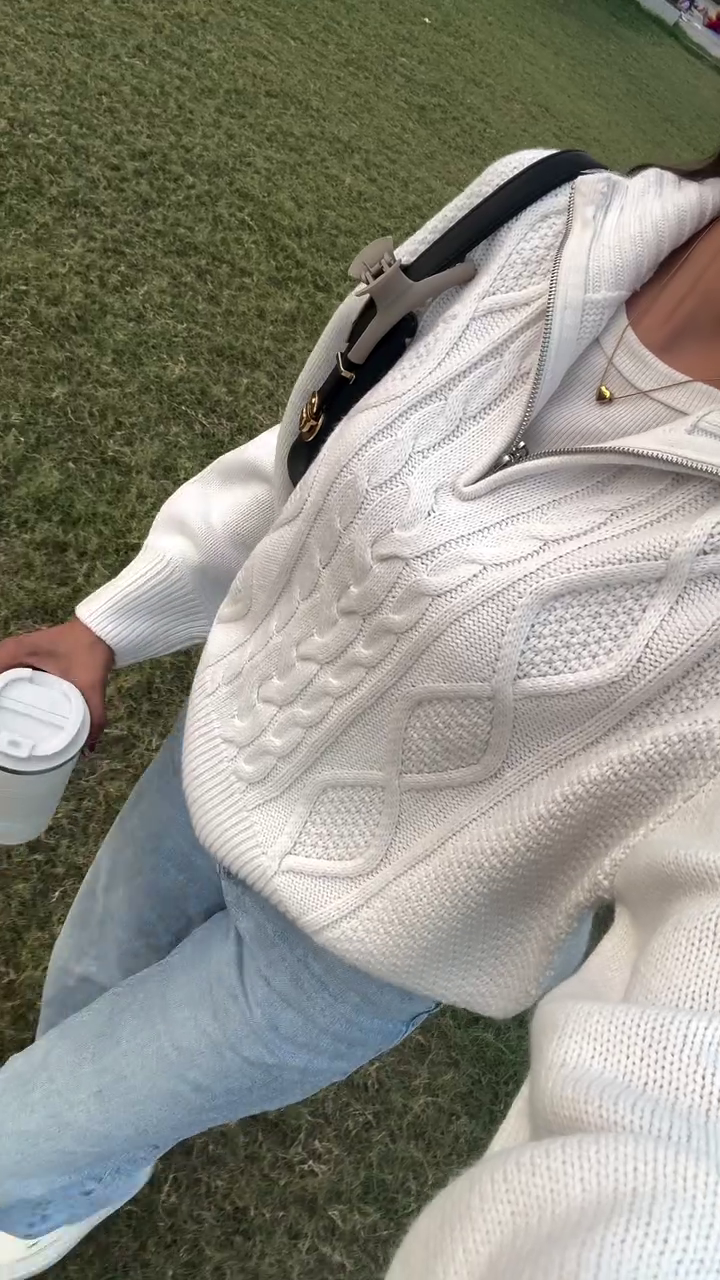 Cozy Cream Cable Knit Sweater Styled with Light Denim for Casual Elegance