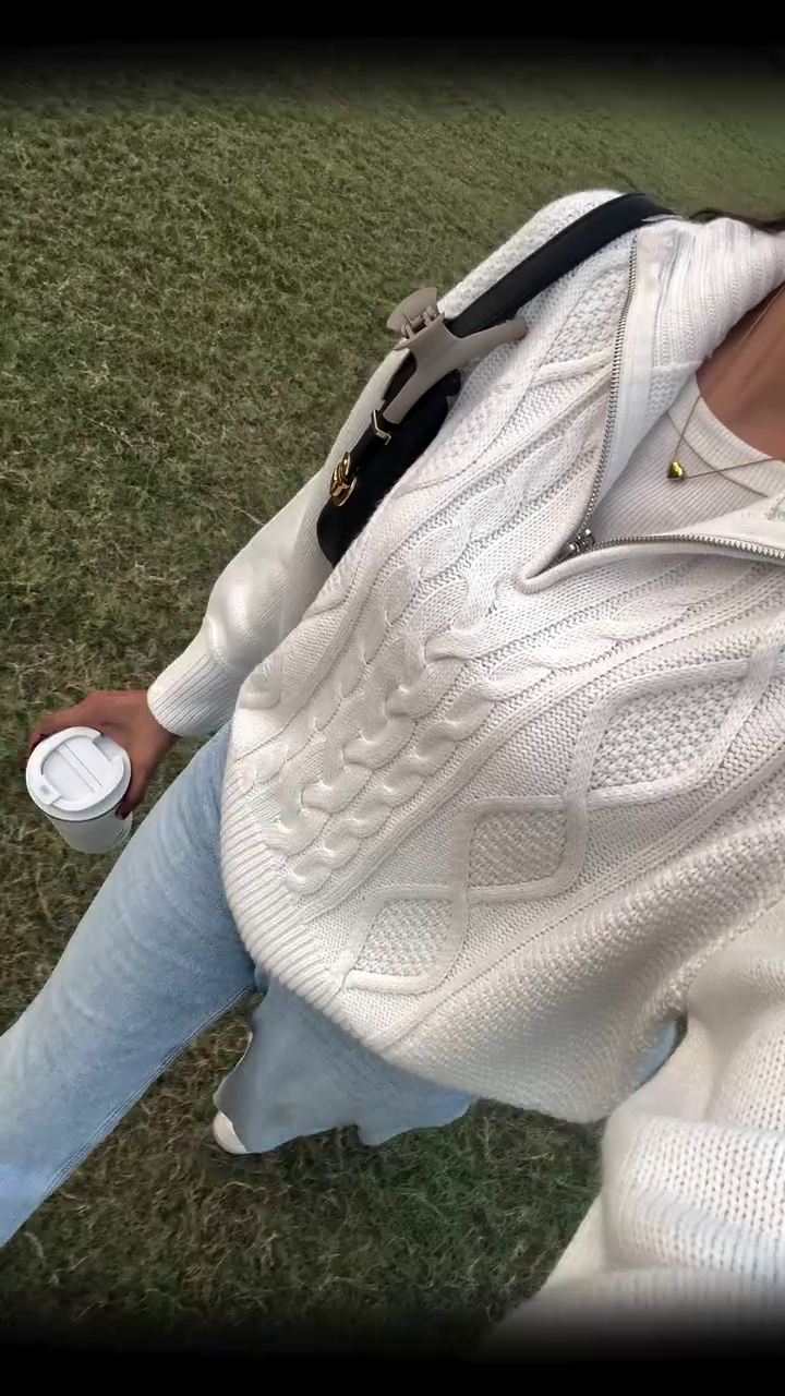 Cozy Cream Cable Knit Sweater Styled with Light Denim for Casual Elegance