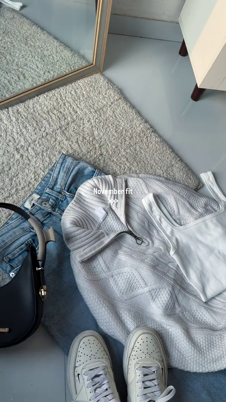 Cozy Cream Cable Knit Sweater Styled with Light Denim for Casual Elegance