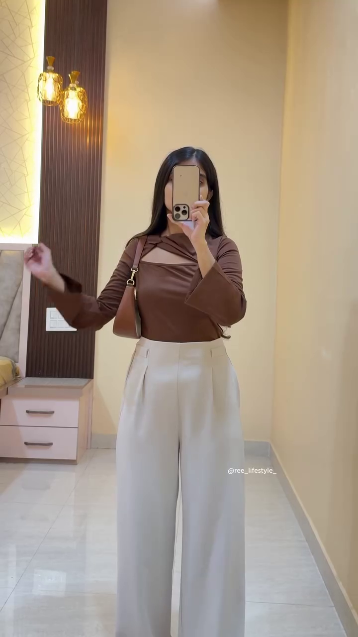 Smart Casual Chic: Mauve Fitted Top with Beige Wide-Leg Trousers