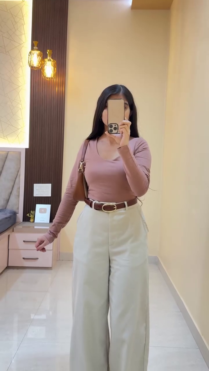 Smart Casual Chic: Mauve Fitted Top with Beige Wide-Leg Trousers