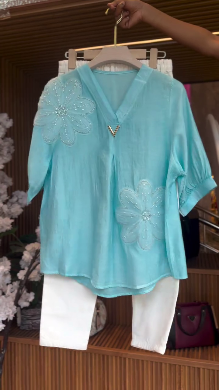 Turquoise Embellished Top with White Trousers