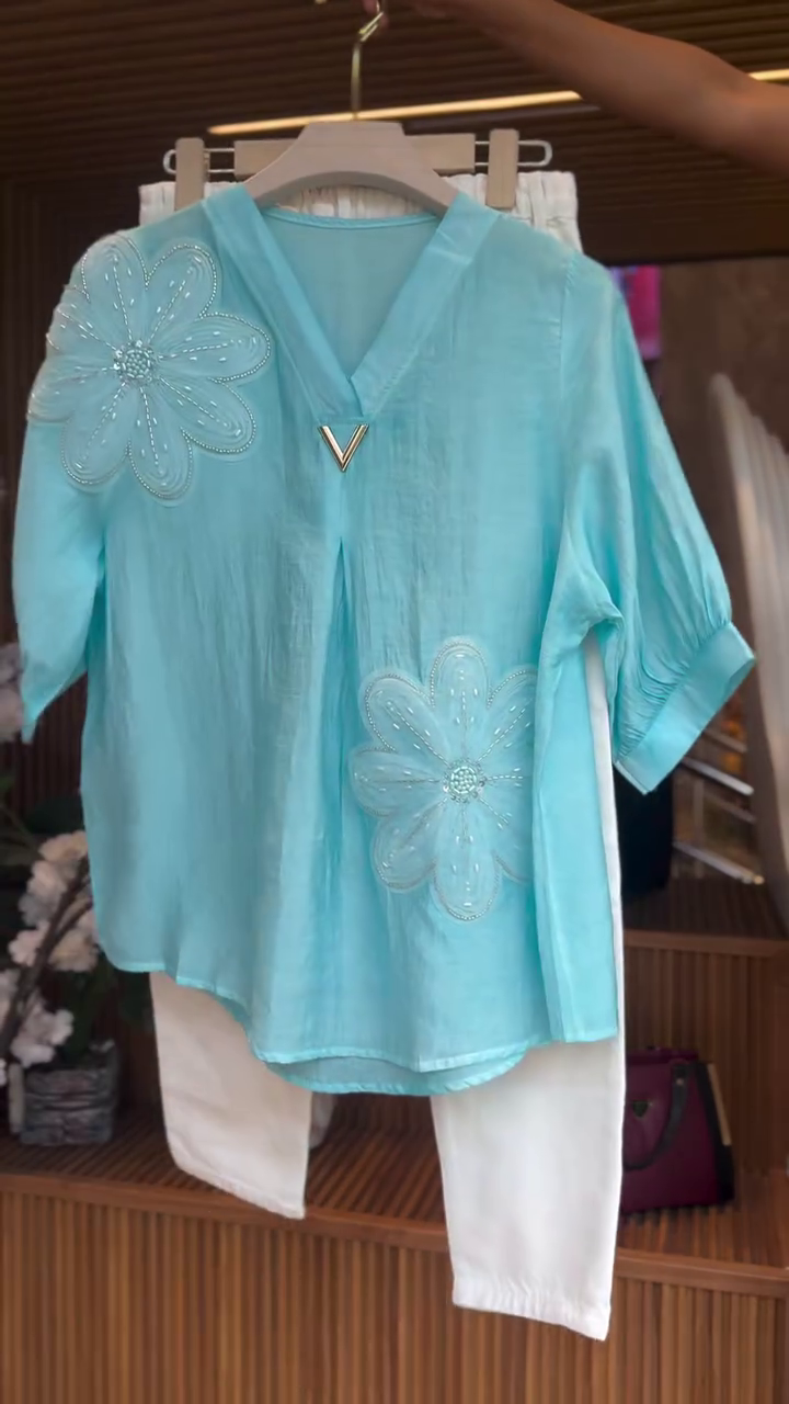 Turquoise Embellished Top with White Trousers