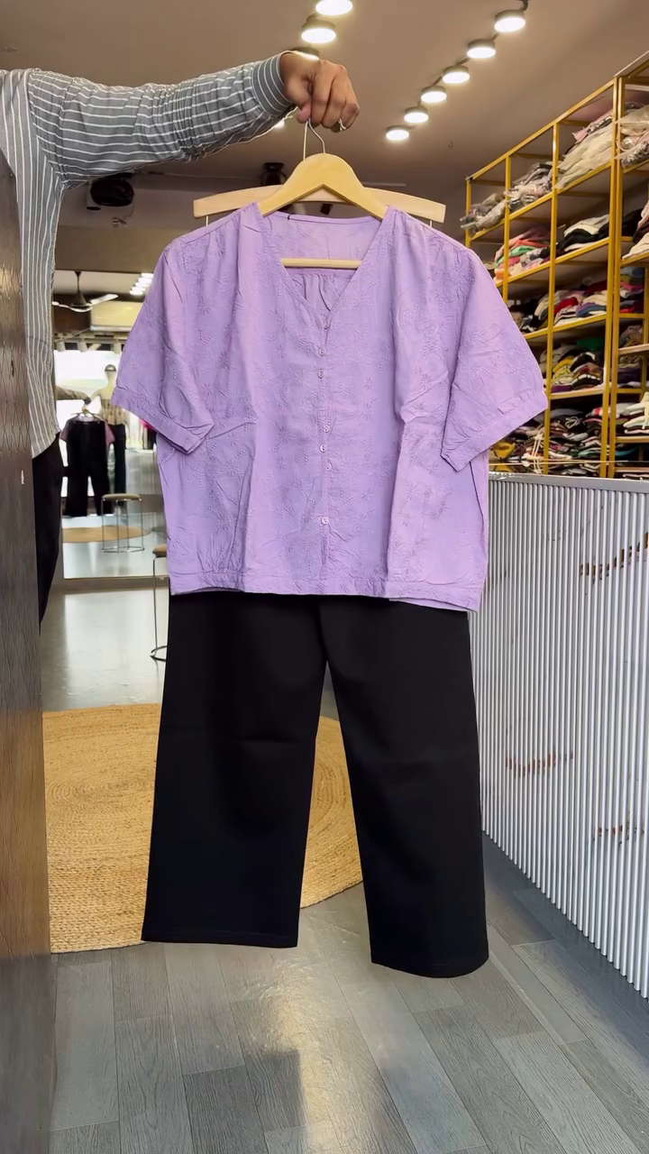 Elegant Lavender Top with Classic Black Wide-Leg Trousers